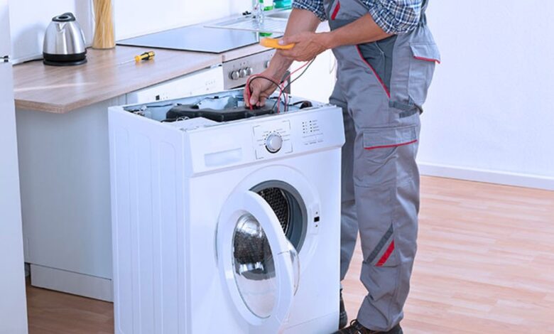 A man repair a washing machine